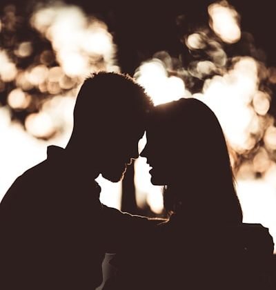 couple is having making romance under tree shadow